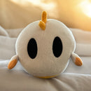 Plush toy of ghost with black eyes, orange hair and base. Beans on bottom.